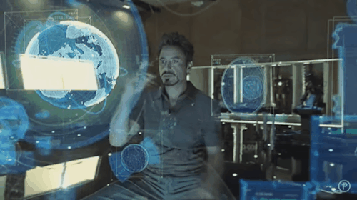 Iron Man interacting with Jarvis holographic interface